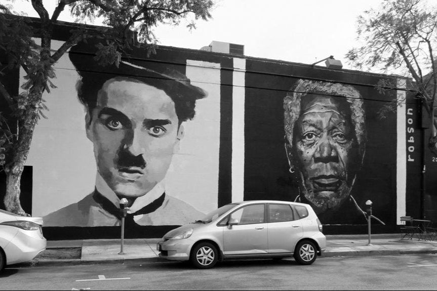 Brad Robson mural at Los Feliz 3 Theatre, Hollywood, featuring Morgan Freeman, Charlie Chaplin, Cleopatra, and Cate Blanchett