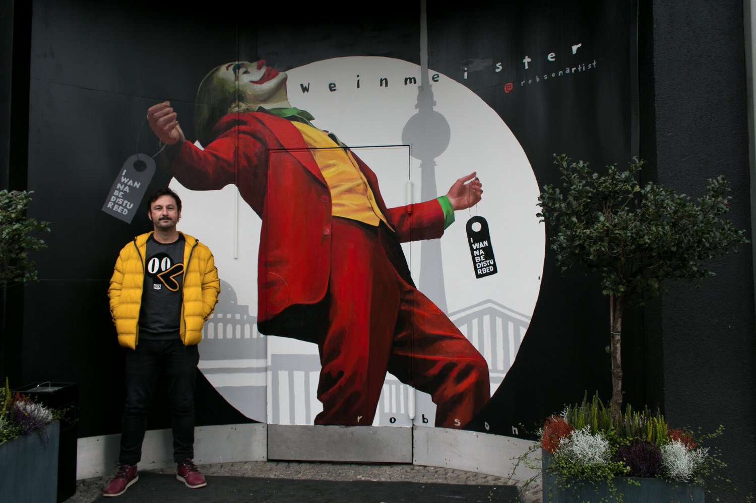 Berlin mural “I Wanna Be Disturbed” by Brad Robson, portrait of the Joker played by Joaquin Phoenix